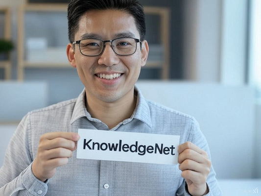 Smiling professional holding KnowledgeNet.ai sign in modern office.
