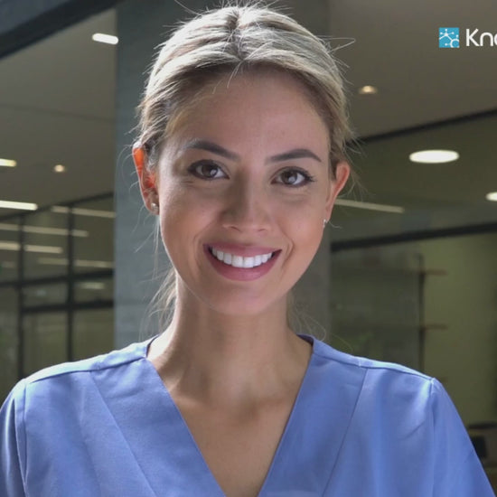 Smiling professional in scrubs representing KnowledgeNet.ai Sales Leads Tools - Custom Platform (Paid) Business AI software for healthcare sales insights.